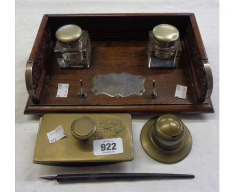 An Edwardian wooden inkstand with carved gallery and two inkwells - sold with another inkwell, brass blotter and dip pen