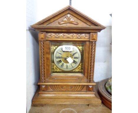 An early 20th Century German walnut cased table clock of architectural design with Junhans eight day gong striking movement