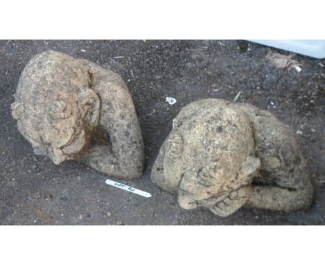 A pair of concrete wall gate keepers