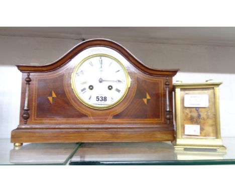 An Edwardian ornate inlaid mahogany mantle clock with French eight day gong striking movement - sold with a brass and bevelle
