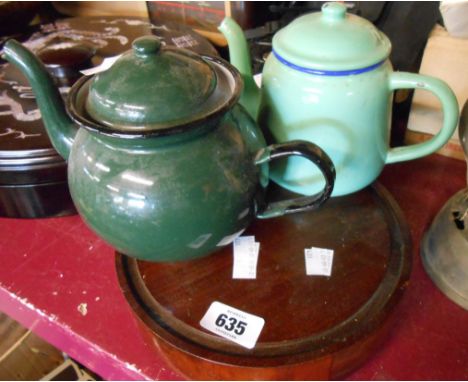 Two small vintage green enamel teapots - sold with an old wooden stand