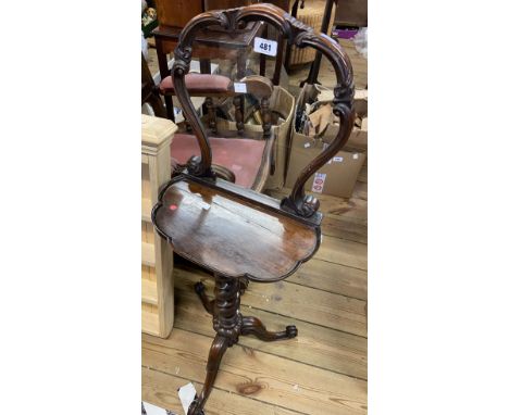 An antique rosewood pedestal table with added shaped mirror back, set on barley twist pillar and tripod base