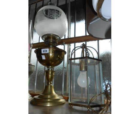 An old brass oil lamp with chimney and etched globe shade - sold with a vintage electric hanging hall lantern