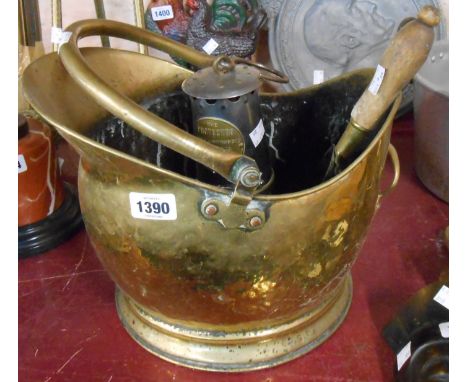 A brass helmet coal scuttle and shovel - sold with a brass and steel The Protector Miners Lamp