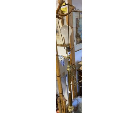 An antique brass telescopic lamp stan dard, set on heavy domed and reeded circular base - converted to electricity