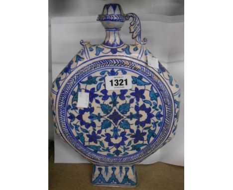 An old Persian moon flask decorated in turquoise and blue - one handle a/f