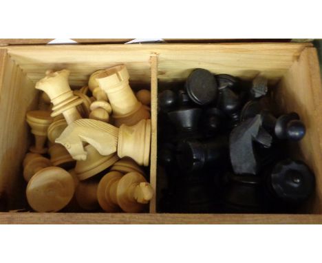 A vintage wooden chess set contained in a wooden box