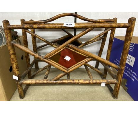 A late Victorian bamboo magazine rack with remains of lacquered panel decoration - sold with a vintage wall mounted storage u