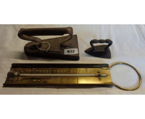 A 19th Century cast iron miniature flat iron - sold with a larger decorative similar and a brass sugar thermometer