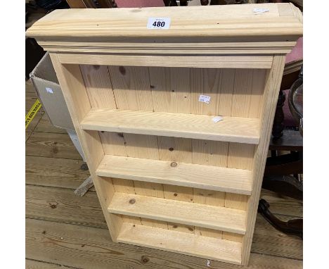 A 48cm modern pine wall mounted four shelf unit