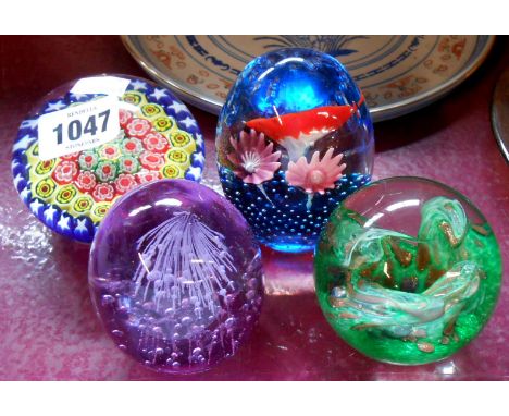 A vintage Murano millefiorie ground paperweight - sold with three other glass paperweights
