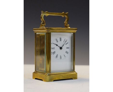 Early 20th Century French brass cased carriage clock, the white enamel dial with Roman numerals, back plate with retailers ma