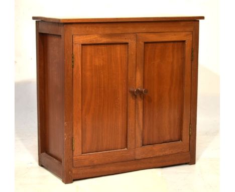 Vintage teak cabinet with rectangular top over twin cupboard doors enclosing shelf, 69cm wide   Condition: 