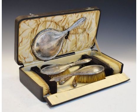 George V engine turned silver backed five piece brush set, Birmingham 1923, together with two other pieces   Condition: 