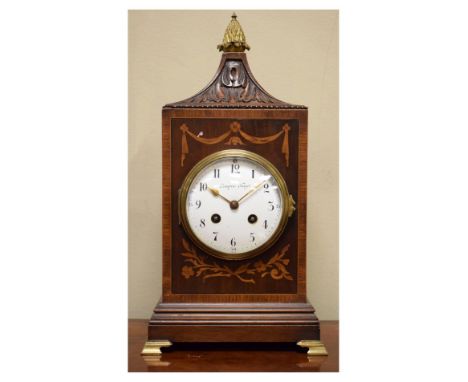 Early 20th Century inlaid and crossbanded mahogany lantern top mantel clock, the white enamel dial with Arabic numerals, Fren