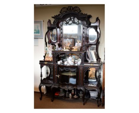 Edwardian stained walnut salon cabinet with pierced arched crest over shaped bevelled mirror between subsidiary mirrors and s