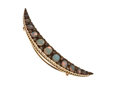 Late Victorian opal and diamond crescent brooch, unmarked, the eleven graduated oval cabochons with rose diamond points betwe