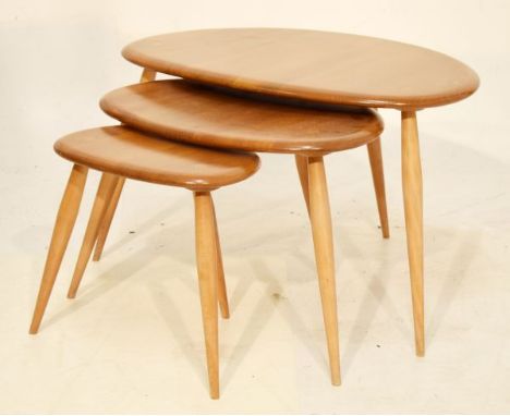 Nest of three Ercol 'Pebble' tables each on four splayed supports Condition:&nbsp;condition seems consistent with age, a few 