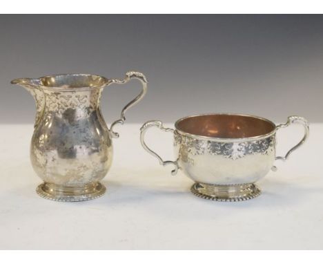George V silver cream jug and two handled sugar basin, London 1910, combined weight 7.6toz approx   Condition: 