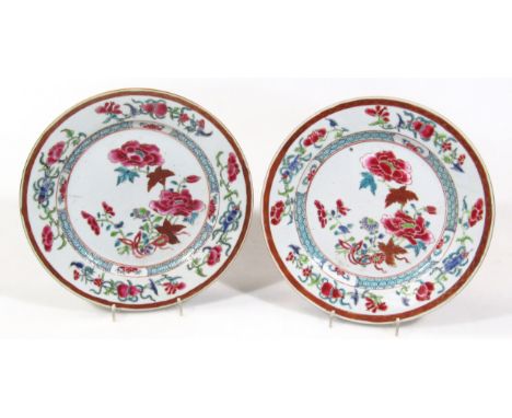 A pair of 18thC Chinese famille rose porcelain plates, with floral enamel central reserves and stylized border, 23cm dia. (2)