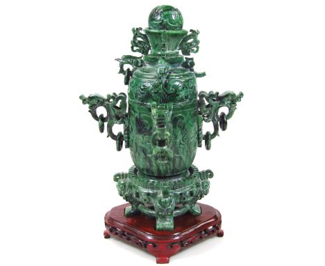 A Chinese late Qing period polished spinach jade coloured stone censer and cover, the domed top with orb finial, raised above