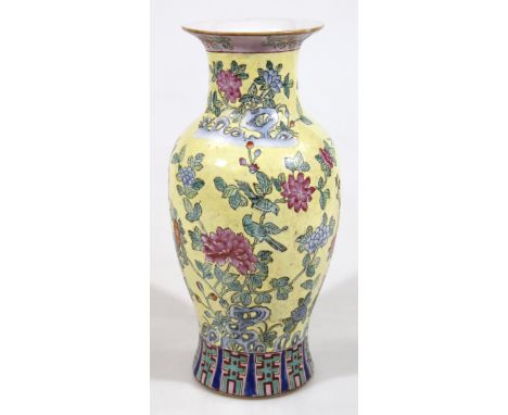 A Chinese semi-porcelain enamel famille jaune vase, with compressed trumpet stem and circular shouldered body, profusely deco