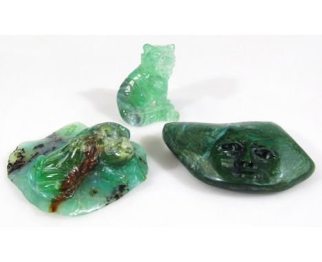 A malachite style polished stone carving, of shaped outline, 9cm wide and two jade finish carvings of a wild dog etc. (3)