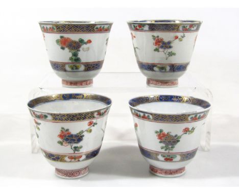 Four 19thC Chinese porcelain bell shaped cups, with blue banding and floral enamel decoration, 7.5cm high. (4)