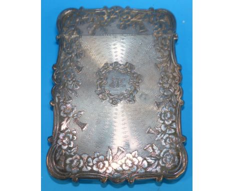 A shaped rectangular crested and monogrammed visiting card case with engine turned and chased floral decoration, by Nathaniel