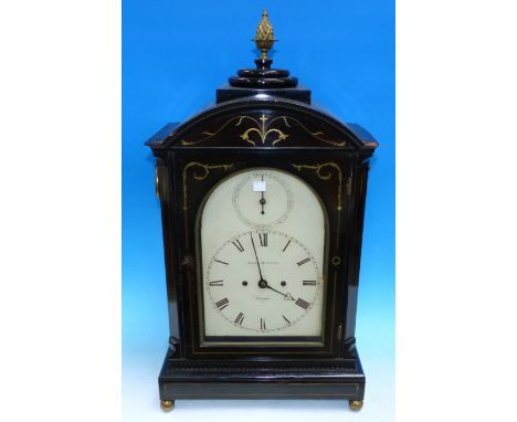 A late George III ebonised bracket clock by James McCabe with brass acanthus and line inlay, the arced top surmounted by bras