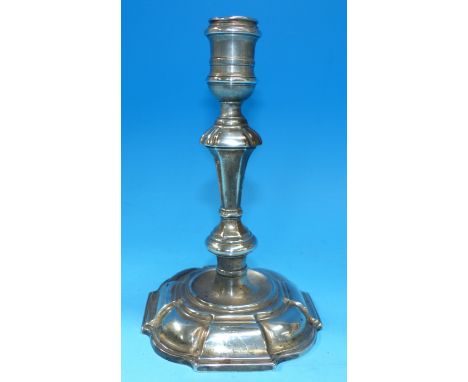 An 18th century cast silver candlestick with tapering bladed knop stem, and domed scalloped base, London 1729, height 7", 12½