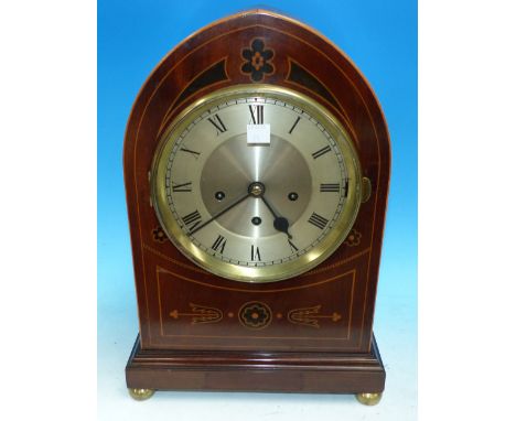 A late 19th century mahogany cased lancet top bracket clock with boxwood line and floral motif inlay, on moulded plinth and 4