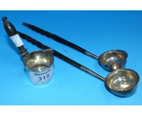 A miniature brandy warmer/ladle with turned ebonised handle, London 1849; a pair of toddy ladles with whalebone handles, Glas