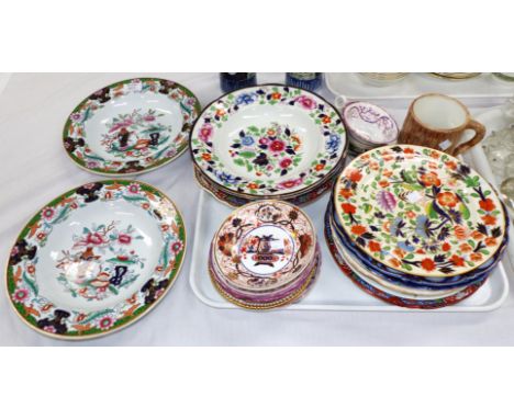 A collection of 19th century English stoneware plates and porcelain saucers; a majolica twin frog mug