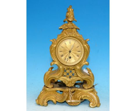 An early 19th century balloon shaped ormolu mantel clock in rococo style case with 2 tier floral finial and scroll and acanth