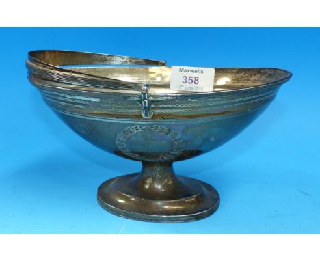 A Classical style oval pedestal dish with swing handle, on raised oval pedestal base, with engine turned and reeded borders, 