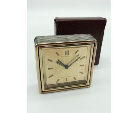 A VINTAGE SILVER GILT BOUCHERON PARIS TRAVEL ALARM CLOCK IN WORKING CONDITIONNEEDS A SERVICE