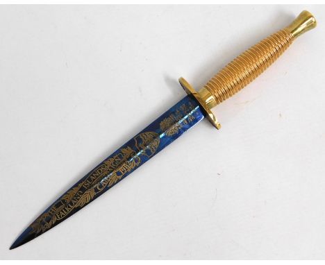 A commemorative Wilkinson Sword 1982 Falkland Islands campaign Fairburn Sykes style marine dagger with blue steel blade & gol