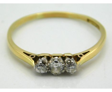 An 18ct gold ring set with three small diamonds, approx. 0.2ct, 1.6g, size R