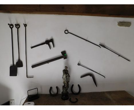Blacksmith's Cottage: A selection of blacksmith tools & forged items twinned with a spelter figure a/f, nine items