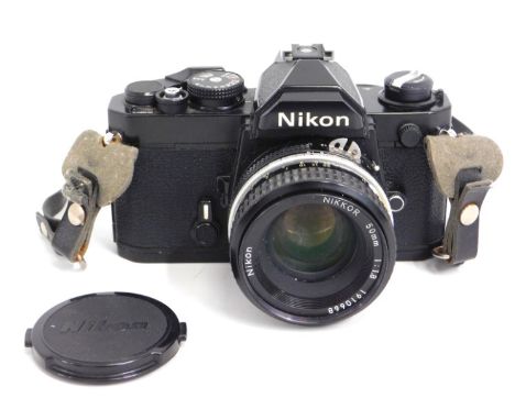 A Nikon FM - 3115998 35mm film camera with lens hood & filter, 50mm Nikon lens