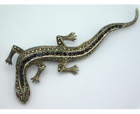 A .925 marked silver lizard brooch set with marcasite, sapphire & ruby, 92mm long, 14.6g