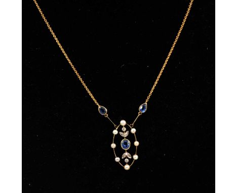 An Edwardian seed pearl,diamond points and untested blue stone pendant with a fine trace link chain attached to each side; a 