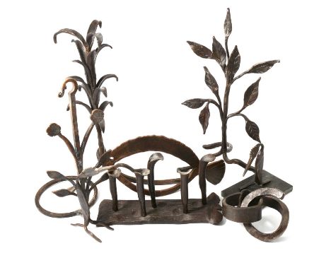 Alan Knight, artist-blacksmith: a collection of wrought ironwork, comprising lily and leaf-formed andirons, 43cm and 41cm, wa