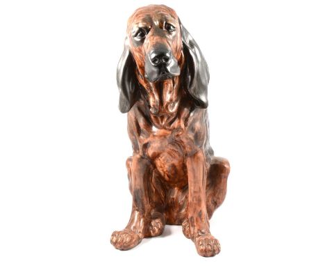 A quantity of mostly Bloodhound dog figures, resign and ceramic, two boxes and a large figure.