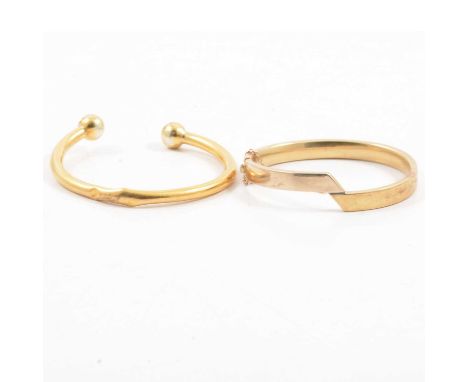 Two yellow metal half hinged bangles and a torque bangle, not marked, 63g, 9 carat yellow gold broken chain necklaces, 21.7g.