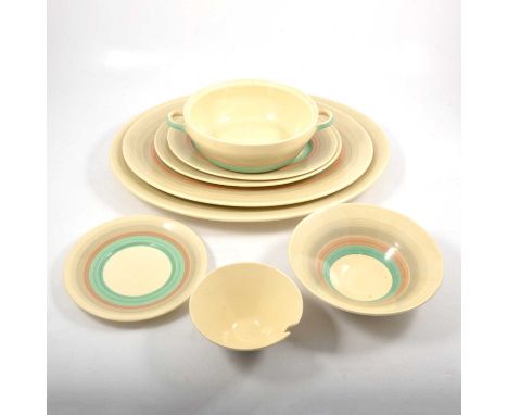 A Susie Cooper Production earthenware part dinner service, concentric bands in cream, green and grey, comprising plates, bowl