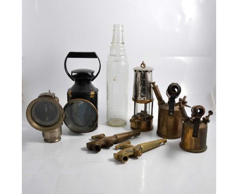 An Essolube quart glass bottle, 38cm; a Lucas motorbike / bicycle lamp; a B.R. (M) Bladon, Birmingham, lamp; a miner's safety