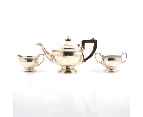 A three-piece silver teaset, Smith &amp; Bartlam, Birmingham 1933-4, comprising teapot with Bakelite handle and finial (15cm)