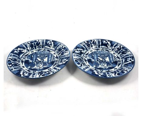 Pair of Chinese blue and white plates, Wanli style, decorated with figures under a pagoda, one cracked, diameter 32cm.